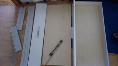 one of the old drawers taken apart to take measurements of its components