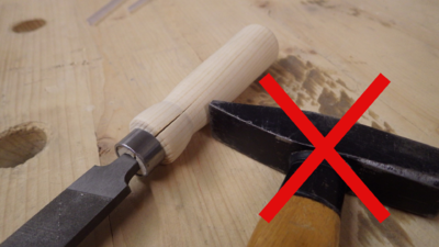 do NOT use a hammer to drive in the file - the hardened steel could break - but instead push it in as far as you can and then hit the workbench surface with the handle's end a few times