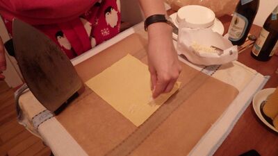 spread the beeswax flakes onto a piece of cotton fabric